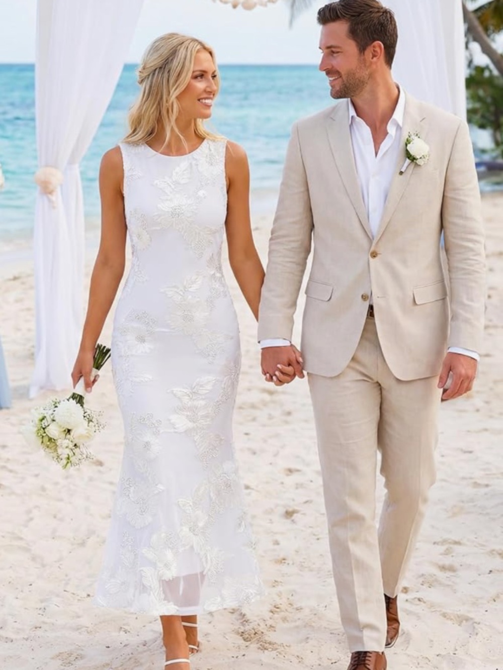 Elegant sleeveless white wedding dress with delicate floral lace embellishments.